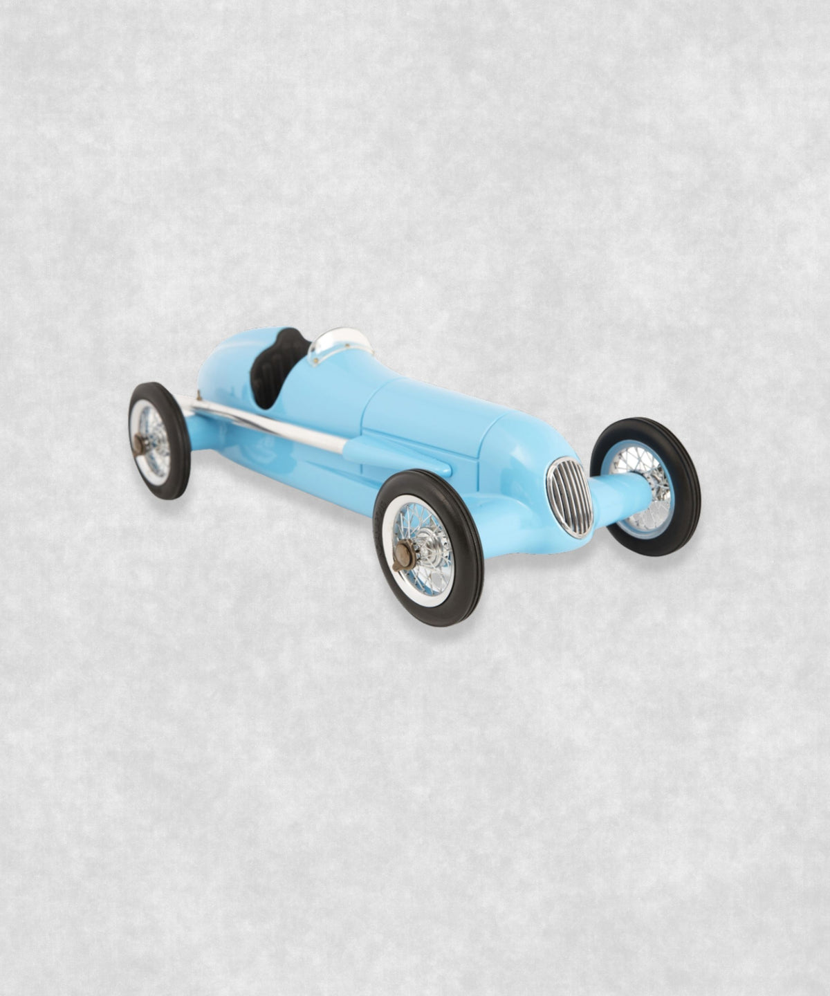Vintage racing silberfeil car model inspired by classic Grand Prix racers and Silver Arrow legends, featuring a blue race car body with a striking black seat. A collectible car model for motorsport and classic car enthusiasts. Viewed from a diagonal perspective.