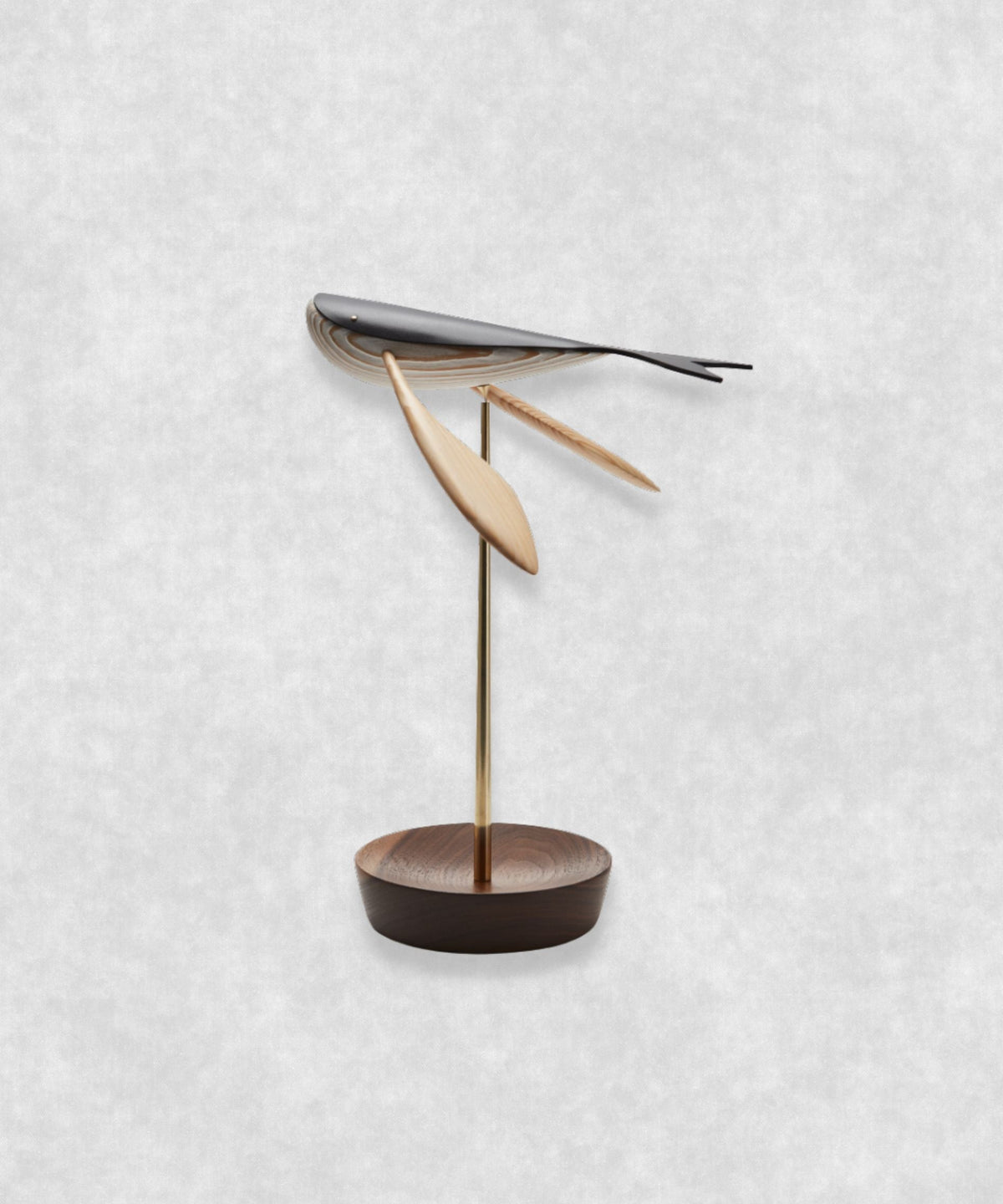 Side view of Flying Whale by Lee Sang-yong – kinetic art sculpture capturing a whale in a graceful floating and balancing form