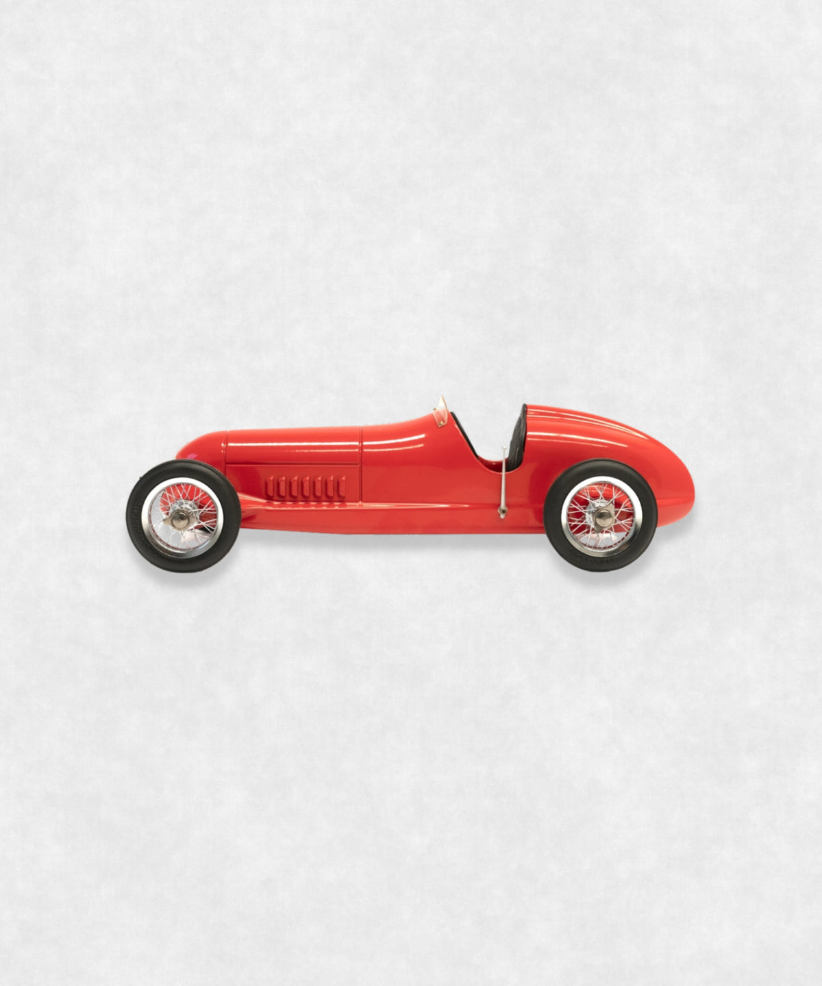 Vintage racing silberfeil car model inspired by classic Grand Prix racers and Silver Arrow legends, featuring a red race car body with a striking black seat. A collectible car model for motorsport and classic car enthusiasts. Viewed from the left side.