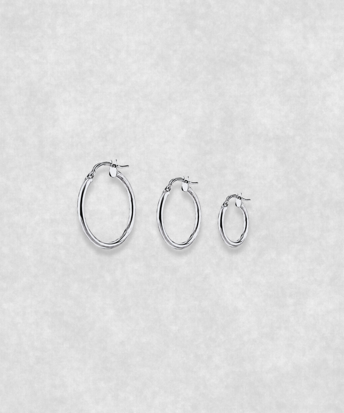 Silver hoop earrings available in three sizes – small, medium and large minimalist hoops