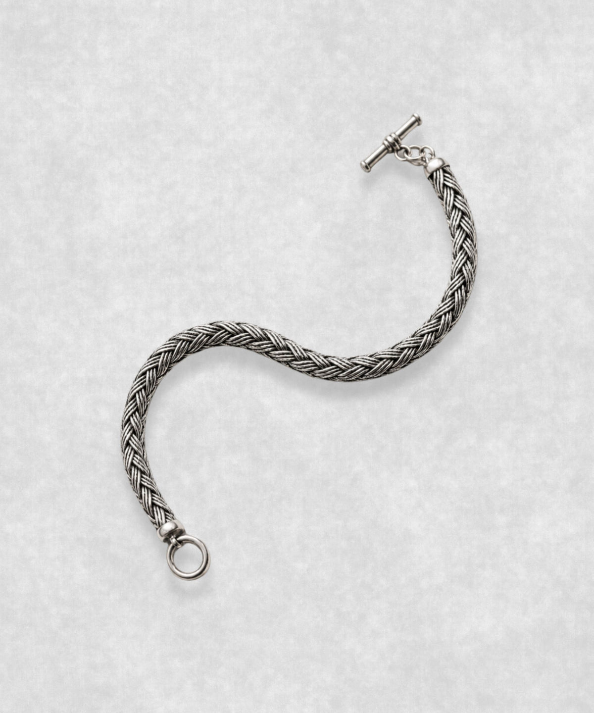 The Braid sterling silver bracelet open in S shape – handcrafted 925 silver braided chain with toggle clasp