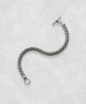 The Braid sterling silver bracelet open in S shape – handcrafted 925 silver braided chain with toggle clasp