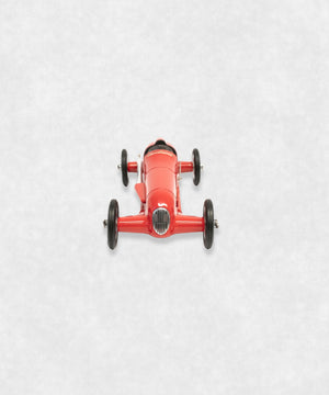 Vintage racing silberfeil car model inspired by classic Grand Prix racers and Silver Arrow legends, featuring a red race car body with a striking black seat. A collectible car model for motorsport and classic car enthusiasts. Viewed from  the front