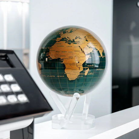 MOVA Emerald Gold Political Map Globe displayed on an office desk – self-rotating green and gold decorative globe