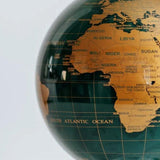 Close-up of MOVA Emerald Gold Political Map Globe – green self-rotating globe with detailed gold countries and borders