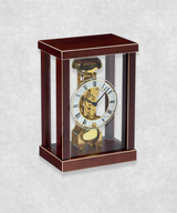 Side view of 14-day mechanical clock with brown natural wood frame – exposed movement, pendulum and hourly bell chime