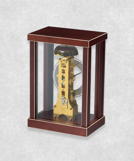 Back view of 14-day mechanical clock with brown natural wood frame – exposed movement, pendulum and hourly bell chime