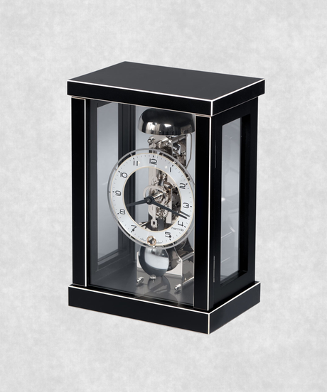 Side view of 14-day mechanical clock with black-painted natural wood frame – exposed movement, pendulum and hourly bell chime